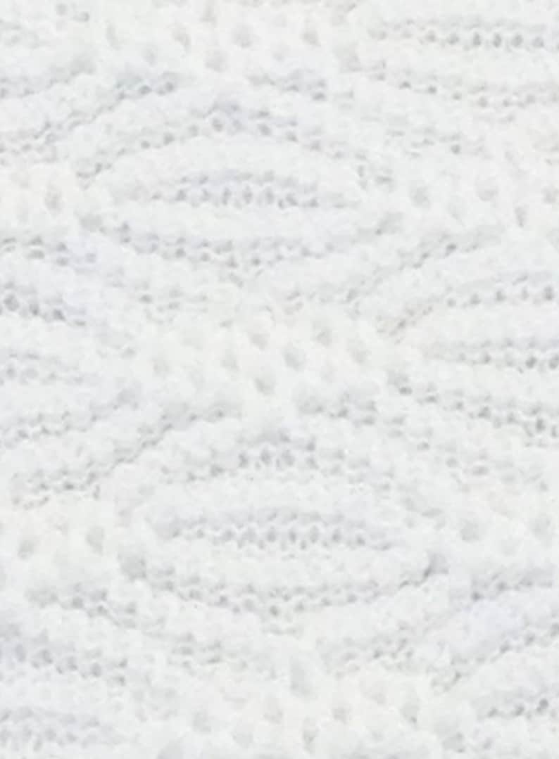 May include: White lace fabric with a delicate pattern. The fabric is soft and has a subtle sheen.