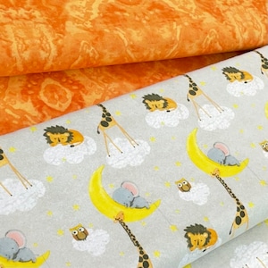 May include: A gray and white fabric with a repeating pattern of animals sleeping on clouds and moons. The animals include lions, elephants, and owls. The fabric has a subtle orange and yellow marbled pattern in the background.