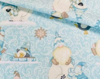 May include: A blue and white fabric with a winter theme. The fabric features gnomes, penguins, and snowflakes. The fabric has a glittery texture.