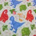 Dinosaur Fabric Flannel, prehistoric top quality Flannel, baby blanket fabric, sewing material, crafts, pale green with colorful dinosaurs
