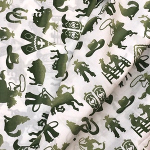 Western Cowboy icon fabric, cactus lasso roping, coyote, buffalo, boots, Fandango, white green, Southwest, cotton, by the yard