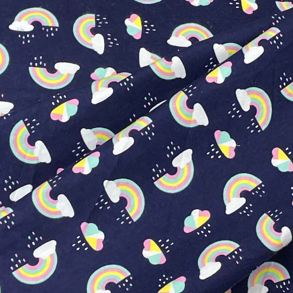 Rainbow flannel fabric, Navy blue, colorful rainbows tossed, pink blue yellow, rain clouds, blue sky, quilting children blanket