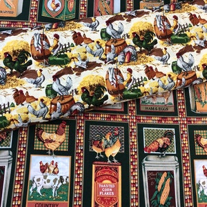 May include: Green fabric with a repeating pattern of farm animals, including roosters, chickens, cows, and corn. The fabric features a variety of colors, including red, yellow, green, and brown. The fabric also includes text, such as "Golden Corn", "Toasted Corn Flakes", "Country", and "Ham & Eggs".