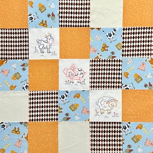 May include: A patchwork quilt featuring a farm animal theme. The quilt is made up of squares of various fabrics, each with a different animal design. The animals include cows, pigs, sheep, and chickens. The quilt is in shades of brown, orange, white, and blue.