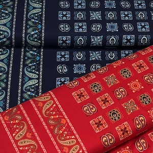 May include: Three different fabric swatches with paisley and geometric patterns. The top swatch is navy blue with white paisley and geometric patterns. The middle swatch is navy blue with white paisley and geometric patterns. The bottom swatch is red with white paisley and geometric patterns.