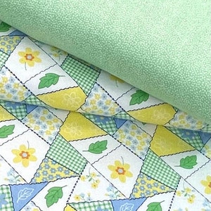 May include: Two pieces of fabric, one green with a subtle texture and the other a patchwork of yellow, green, blue, and white squares with floral designs.