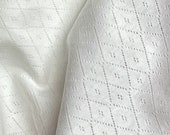 Pointelle Knit white argyle diamonds by Tonka Textiles, triangles, combed cotton blend, stretch, apparel knit, sewing material, 58 quot -60 quot wide