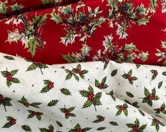 May include: Two fabric swatches with a repeating pattern of holly leaves and red berries. The top swatch is red with a darker red background and the bottom swatch is white with a light beige background.