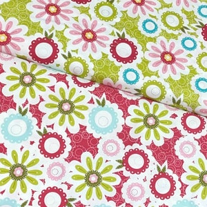 May include: A fabric with a repeating pattern of pink, green, and white flowers on a white background. The flowers have a simple, stylized design.
