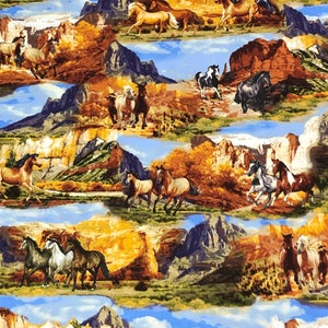 May include: A colourful fabric featuring a repeating pattern of horses running through a mountainous landscape. The horses are brown, white, and black, and the mountains are a mix of brown, green, and blue. The fabric has a light blue background.