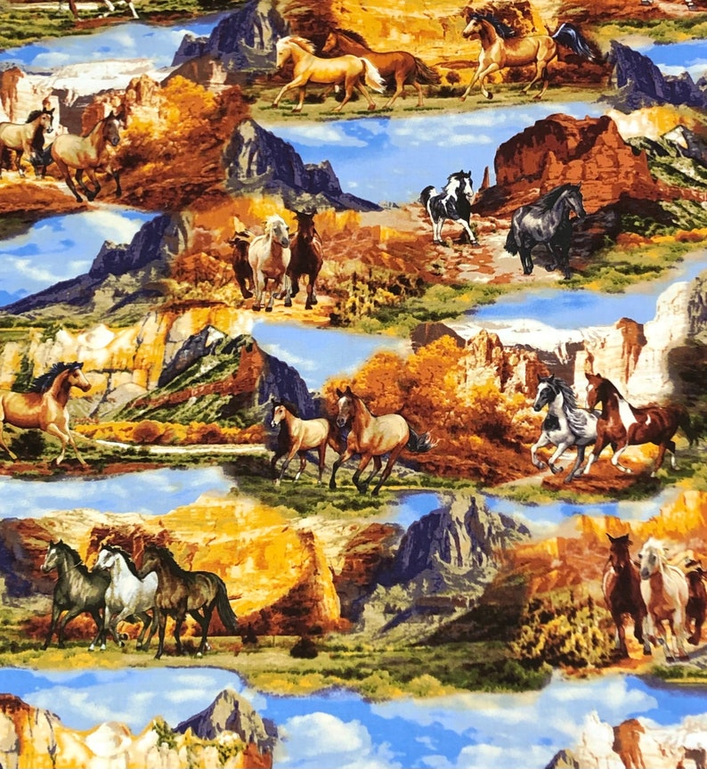 May include: A colourful fabric featuring a repeating pattern of horses running through a mountainous landscape. The horses are brown, white, and black, and the mountains are a mix of brown, green, and blue. The fabric has a light blue background.