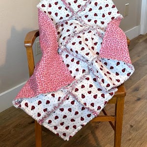 Ladybug red pink rag quilt, 3 warm flannel layers, 33 x 38,  lady bug on white, sweet baby girl soft warm blanket, baby shower gift