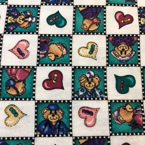 May include: A white fabric with a repeating pattern of teddy bears wearing different outfits and holding hearts. The bears are in teal, purple, pink, and blue frames with black and white borders. The hearts are in various colors, including red, pink, green, and yellow.