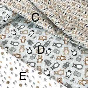 May include: Three different fabric swatches with repeating patterns. The top swatch features a brown and white striped background with a repeating pattern of pandas and bears. The middle swatch features a light gray background with a repeating pattern of pandas, bears, and koalas. The bottom swatch features a white background with a repeating pattern of small brown and blue trees.