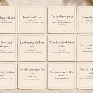 May include: Twelve square cards with inspirational quotes from the Bible. Each card has a cream background with black text. The quotes include: "Peace I leave with you," "Be still and know," and "The Lord gives peace."