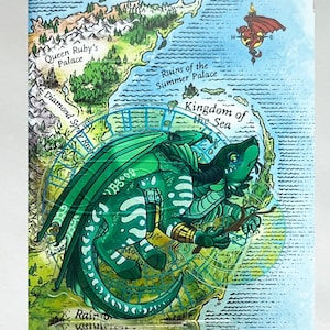 May include: An illustrated map featuring a green dragon and a red dragon, with text indicating locations such as Queen Ruby's Palace and the Kingdom of the Sea. The green dragon is holding a branch. The map is detailed.