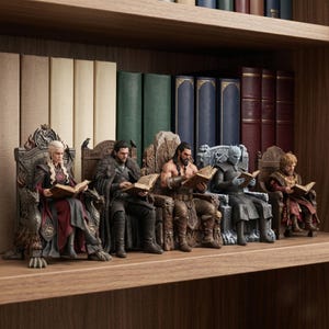May include: A set of five detailed character figurines sitting on ornate thrones, each holding an open book. The figures include a blonde woman in a red dress, a man in a fur-lined cloak, a shirtless muscular man, a blue-skinned figure, and a man in a brown tunic.