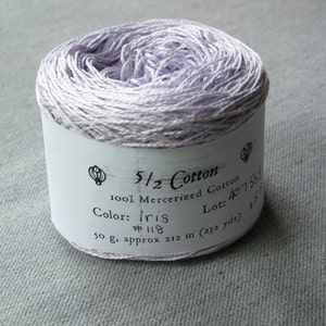 May include: A skein of lavender-colored 5/2 cotton yarn, labeled "5/2 Cotton 100% Mercerized Cotton Color: Iris #118 Lot: 407558 50 g, approx 212 m (232 yds)"