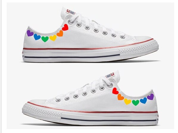 white converse with rainbow stitching