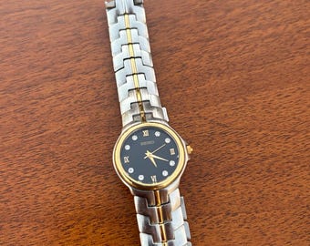 Reloj Seiko vintage 1N01-H966 con bisel y correa de oro de 18k.