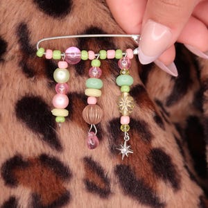 May include: A handmade wooden sign with the text "Welcome" in a playful font. The sign is painted white with a distressed finish, and features a small, decorative heart. It measures approximately 12 inches wide.