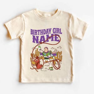 Personalized Sheriff Shirt, Custom Deputy Name T-Shirt, Space Ranger Cowboy Tee, Kids Western Birthday Gift, Toddler Buzz Lightyear Shirt

Step into an adventure-filled world for your little hero! This custom-designed t-shirt blends a beloved space-themed character with a fun western twist, sparking your child's imagination. It is the perfect outfit for birthday parties and a stylish choice for everyday playtime.