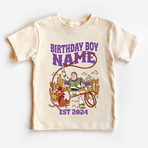Personalized Sheriff Shirt, Custom Deputy Name T-Shirt, Space Ranger Cowboy Tee, Kids Western Birthday Gift, Toddler Buzz Lightyear Shirt

Step into an adventure-filled world for your little hero! This custom-designed t-shirt blends a beloved space-themed character with a fun western twist, sparking your child's imagination. It is the perfect outfit for birthday parties and a stylish choice for everyday playtime.