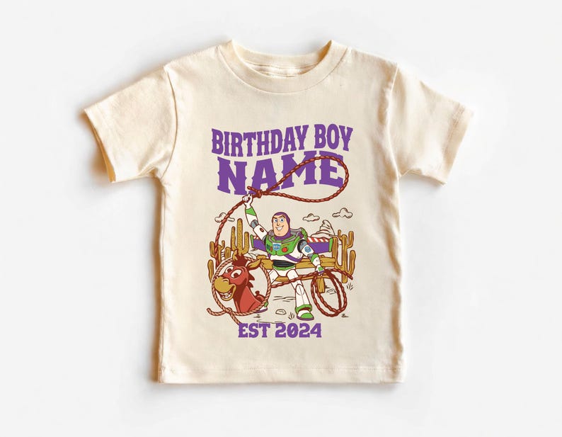 Personalized Sheriff Shirt, Custom Deputy Name T-Shirt, Space Ranger Cowboy Tee, Kids Western Birthday Gift, Toddler Buzz Lightyear Shirt

Step into an adventure-filled world for your little hero! This custom-designed t-shirt blends a beloved space-themed character with a fun western twist, sparking your child's imagination. It is the perfect outfit for birthday parties and a stylish choice for everyday playtime.