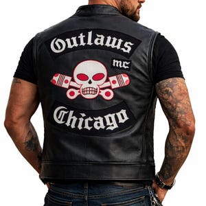 May include: Black leather vest with the Outlaws MC logo on the back. The logo features a skull with red eyes and crossed pistons, with "Outlaws" and "Chicago" in white lettering.