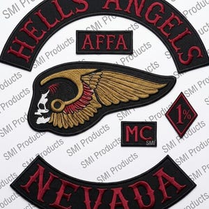 May include: Set of black embroidered patches with red lettering and accents. Includes a curved patch with "HELLS ANGELS", a rectangular "AFFA" patch, a winged skull patch, a "MC" patch, a diamond "1%" patch, and a curved "NEVADA" patch.