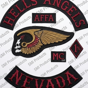 May include: A collection of black embroidered patches with red detailing. Features include a curved patch reading "HELLS ANGELS", a rectangular "AFFA" patch, a winged skull design, a "MC" patch, a diamond "1%" patch, and a "NEVADA" patch.