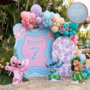 May include: A colorful party scene with a balloon arch in pastel colors, featuring cutouts of Stitch, Angel, and Lilo. The backdrop includes a sign with the name "Olivia" and the number "7". The scene is decorated with floral accents.