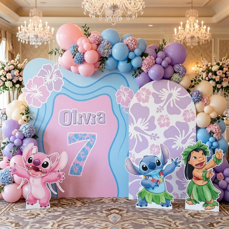 May include: A birthday party backdrop featuring a pink and blue design with the name "Olivia" and the number "7". The backdrop is decorated with balloons, floral arrangements, and cutouts of characters from the movie Lilo & Stitch.