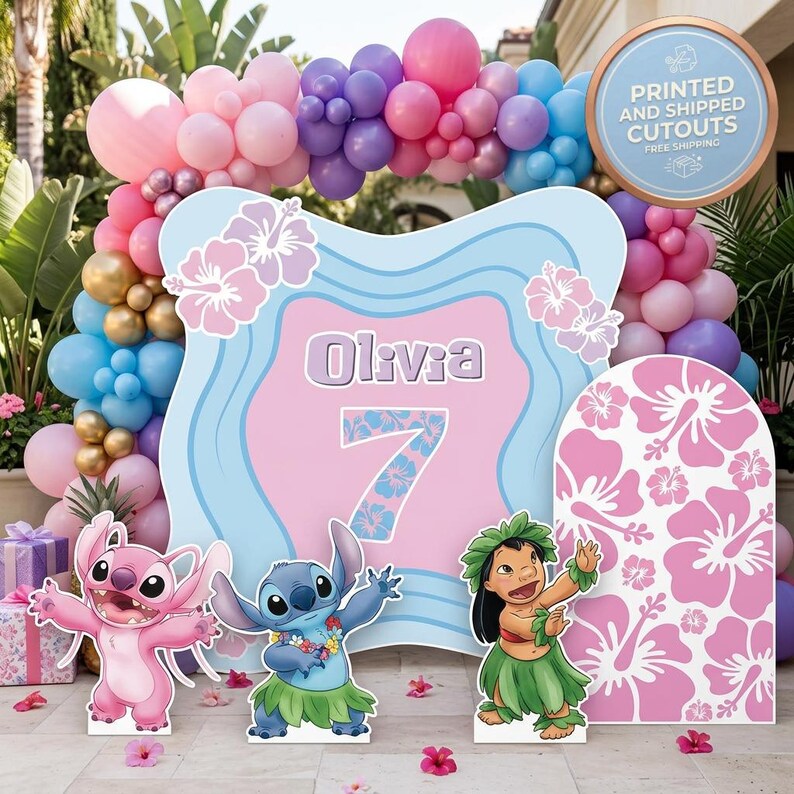 May include: A party decoration set featuring a large sign with the name "Olivia" and the number "7", along with cutouts of cartoon characters and a floral arch made of balloons in pink, blue, purple, and gold. The sign also has hibiscus flowers.