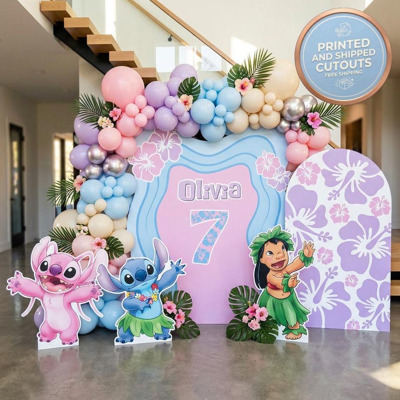 May include: A party decoration set featuring a pink and blue backdrop with the name "Olivia" and the number "7". The scene includes character cutouts, a balloon arch in pastel colors, and tropical floral accents. A sign reads "PRINTED AND SHIPPED CUTOUTS".