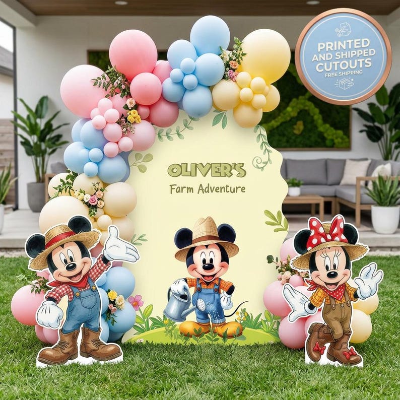 May include: A party backdrop featuring a large pale yellow sign with the text 'OLIVER'S Farm Adventure' and illustrations of Mickey and Minnie Mouse in farm attire. The display is decorated with a balloon arch in pink, blue, and yellow.