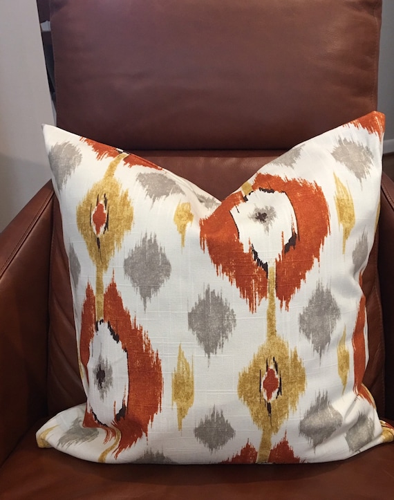 orange ikat pillow