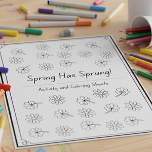 May include: A white activity and colouring sheet with the text "Spring Has Sprung!" and flower illustrations. Coloured pencils and markers in various colours are scattered around the sheet, with a white cup filled with pencils.