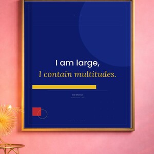 May include: Framed art print with a gold border. The artwork features the quote "I am large, I contain multitudes" in white text on a dark blue background. A yellow horizontal line and a red square with a circle are at the bottom.