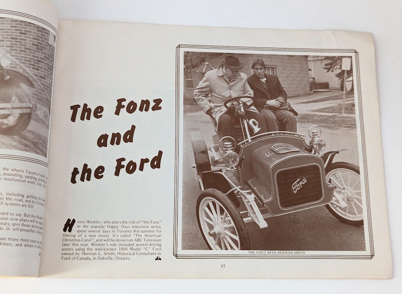 May include: A black and white photo of Henry Winkler, known as "The Fonz" from the TV show "Happy Days", sitting in a vintage 1904 Model "C" Ford. The caption reads "The Fonz with Herman Smith".