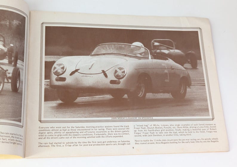 May include: A black and white photo of a silver Porsche 356 Speedster race car on a track. The car is being driven by a person wearing a helmet. The photo is from a vintage magazine.