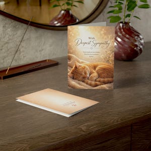 May include: A sympathy card with the words "With Deepest Sympathy" and a sleeping orange tabby cat illustration. The card also includes the text "Some bonds are never broken. They live on in our hearts forever."