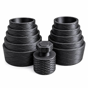 May include: A set of ten matte black circular rings of varying diameters stacked in two columns, accompanied by a single central cylindrical tool with a hexagonal top. Each ring and the central tool feature a consistent diamond-patterned texture.