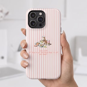 May include: A smartphone case with a light pink and white vertical striped pattern. The center features a cartoon monkey wearing a chef hat, cooking in a kitchen. Below the illustration, the text reads: John 14:8 If God is all you have God is all you need!