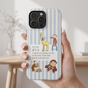 May include: A light blue and white striped phone case featuring illustrations of a giraffe and monkeys, with the text: PSALM 37:5 Commit everything you do to the Lord. Trust him, and he will help you. The design includes a monkey on a giraffe, a monkey brushing teeth, a monkey pouring syrup on pancakes, and a monkey making a heart shape.