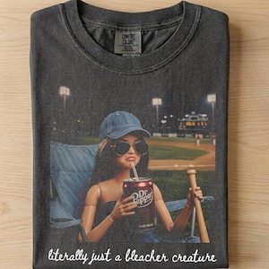 May include: A set of three ceramic mugs with a speckled, matte finish. Each mug features a different color: light blue, cream, and gray. The mugs have a simple, modern design and a comfortable handle.