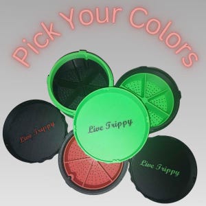 May include: An assortment of colorful, round containers with lids. The lids are black, green, and red, with the words "Live Trippy" printed on them. The text "Pick Your Colors" is in pink above the containers.