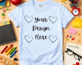 Light Blue Gildan 64000 T-Shirt Mockup | Classroom Flat Lay, School Supplies Background