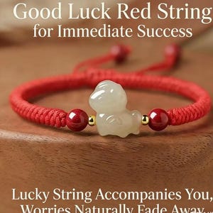 May include: A red string bracelet with a jade charm. The bracelet features red beads and gold accents. The image includes the text "Good Luck Red String for Immediate Success" and "Lucky String Accompanies You, Worries Naturally Fade Away."