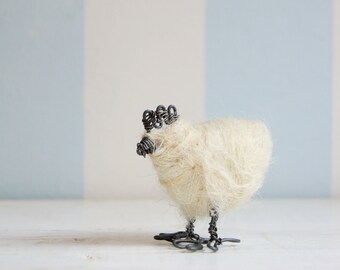 Wired hen with white wool